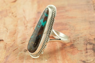 Genuine Royston Turquoise set in Sterling Silver Ring. Beautiful Matrix in this Turquoise Stone. The Royston Turquoise Mine is located in Nye County, Nevada. Created by Navajo Artist Larson Lee. Signed.